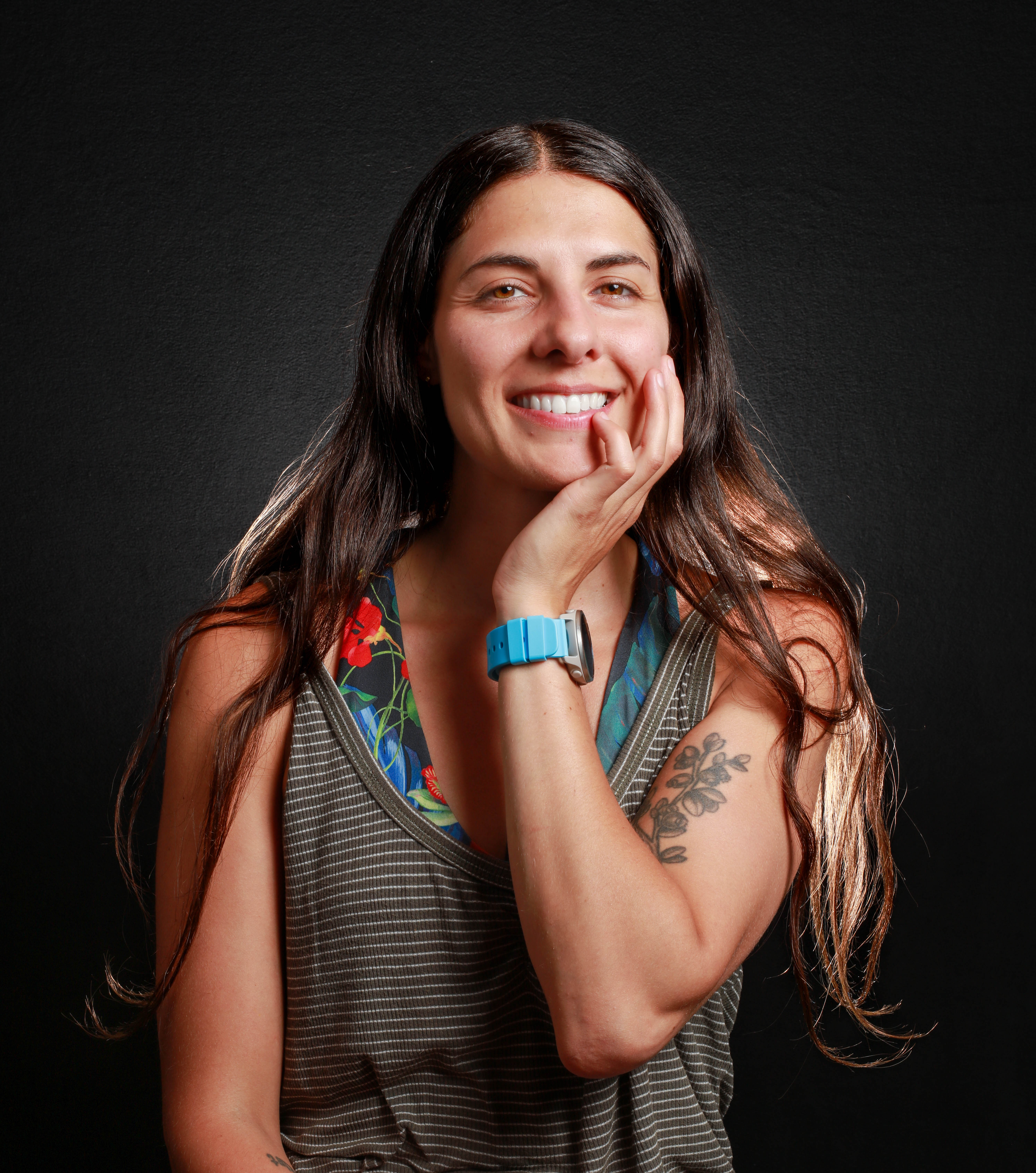 Emny Moghrabi presenting painted paddles and window art