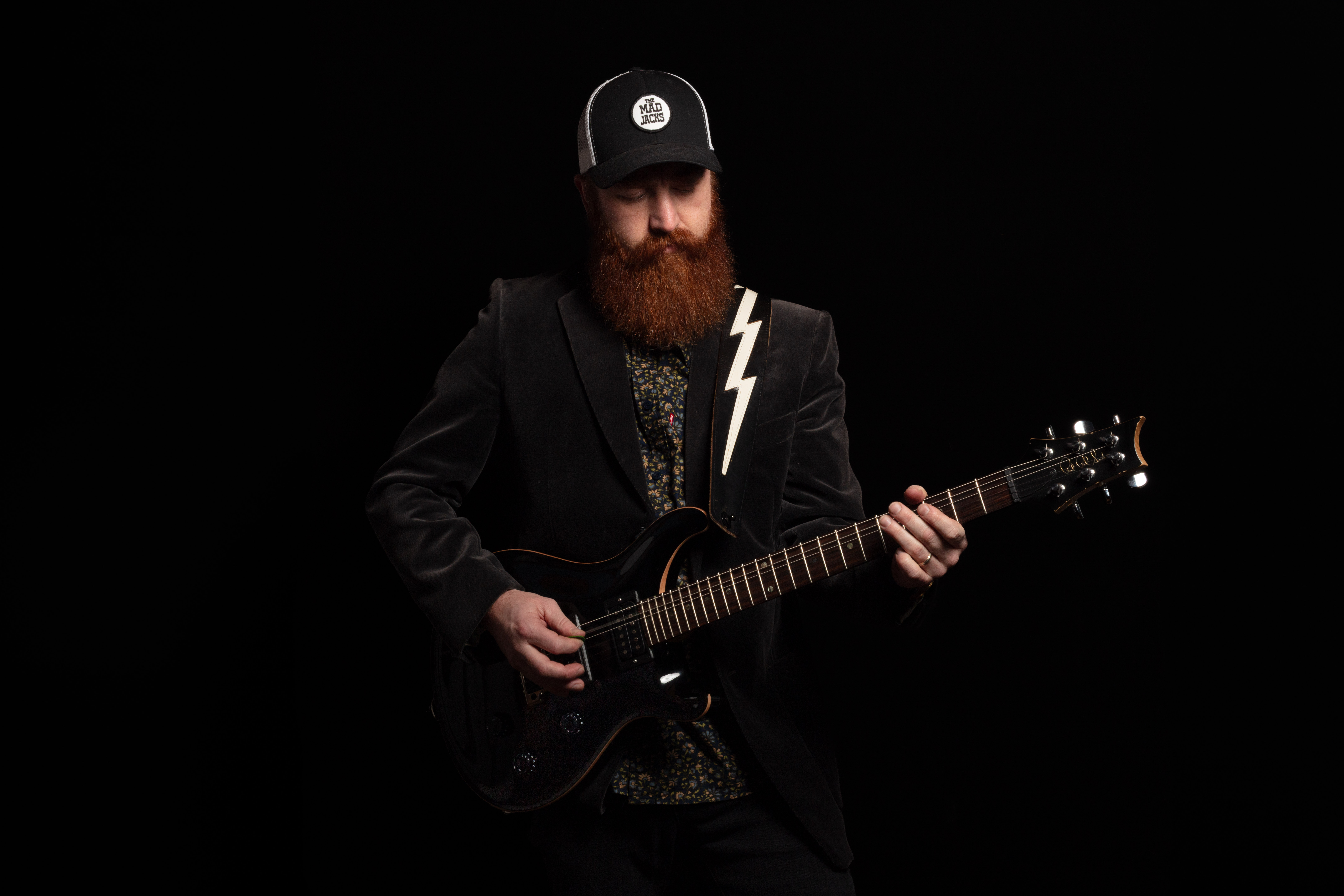 Jayden Madsen performing with his guitar