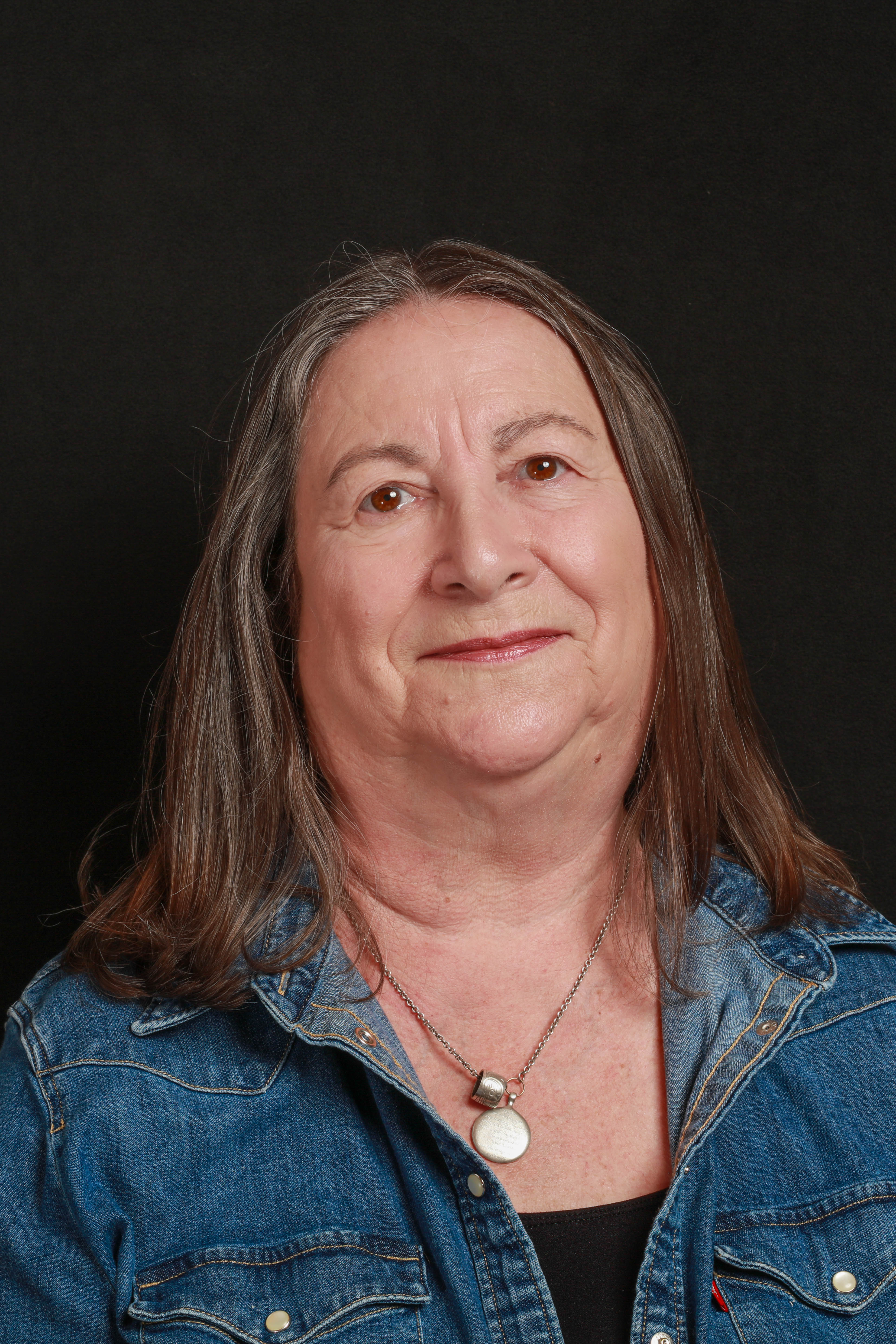 Joan Melvin holding her camera