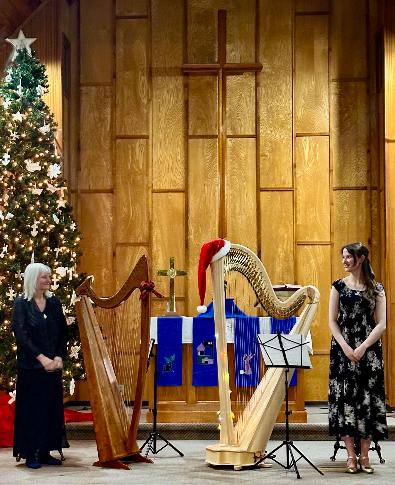 Marilyn Bulger and Amelie Burkinshaw playing two harps together