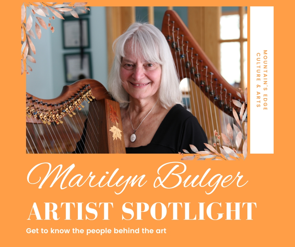 Marilyn Bulger playing harp in a bright studio